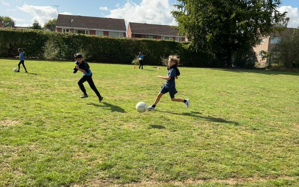 New term, new skills! P.E has started well with football.